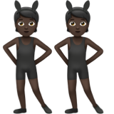 people with bunny ears: dark skin tone as rendered by Apple