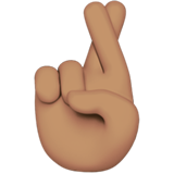 crossed fingers: medium skin tone as rendered by Apple