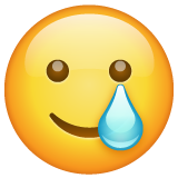 smiling face with tear — WhatsApp