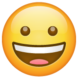 grinning face as rendered by WhatsApp